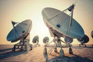 Satellite dish array at sunrise.